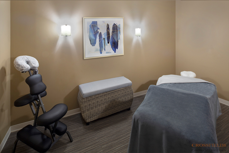 Massage-Room-with-logo-small-chiropractic-office-design