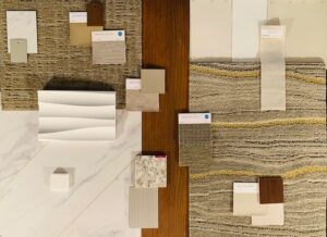 Healthcare office color palette featuring sage green, navy blue, neutral beige and white paint samples with coordinating textures and materials for medical practice design